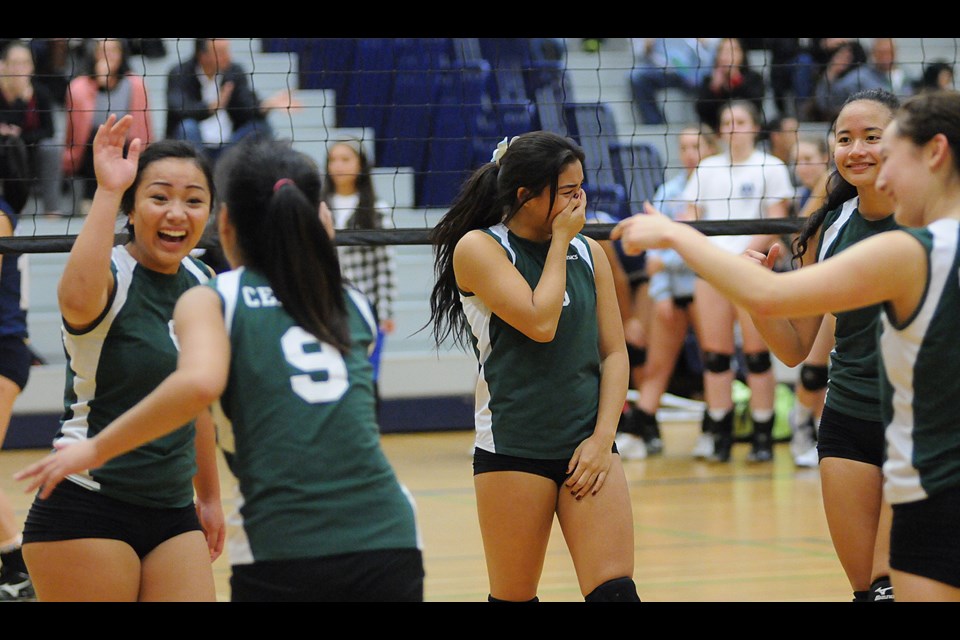 St. Pat's celebrates a point during a quarterfinal win over the Notre Dame Jugglers in the B.C. Catholics championship at Notre Dame secondary Oct. 24, 2014. Photo Dan Toulgoet