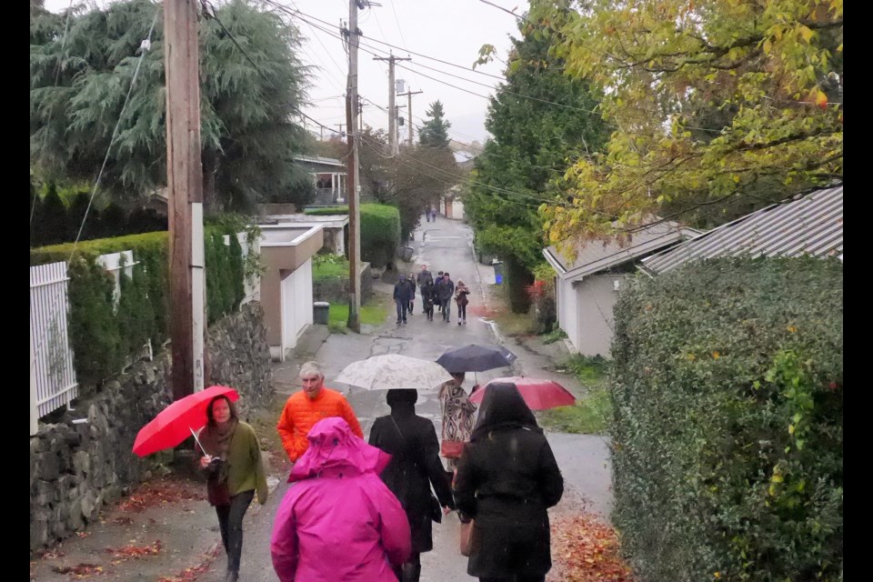 Last Saturday approximately 500 people wandered through Vancouver's back lanes looking at new laneway houses. Photo Michael Geller