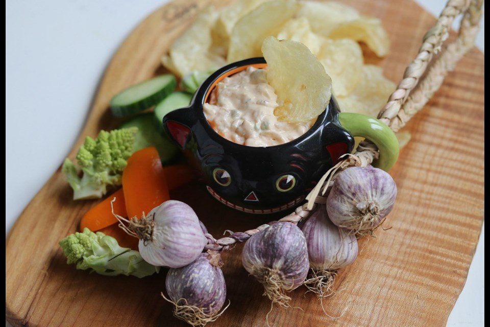 Roasted garlic gives a vampire-vanquishing aroma to this delectable dip for crackers, chips and veggie sticks.