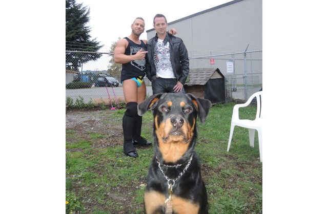 Pro-wrestler Scotty Mac, left, with Richmond animal control officer Shane Burnham and Kona the Rottweiler. Burnham called up his old school friend Mac with the idea of putting on a charity wrestling show in aid of Kona, who needs expensive surgery.