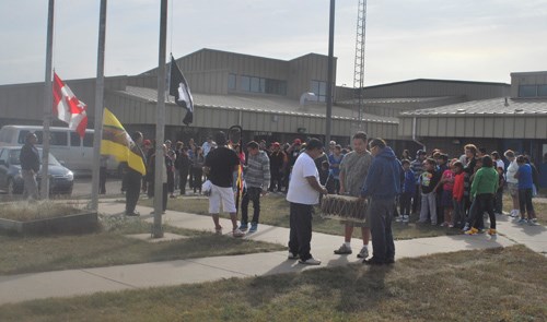 The entire White Bear Education Complex watched as the flags were raised marking the first day of school with two songs.