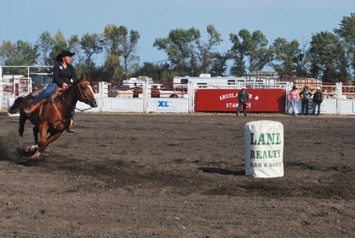 During the Junior High School Rodeo, Celina Cummins, a Kennedy native rounds her second barrel during the barrel race event.
