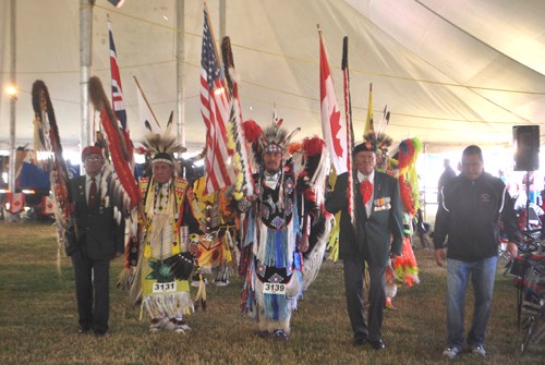 The Grand Entry was led by those honoured with carrying the Eagle staffs.