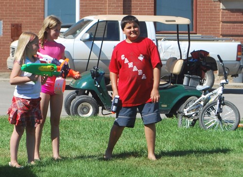 In Manor youth grab their water guns preparing for the water showdown with the fire department at 4 p.m.