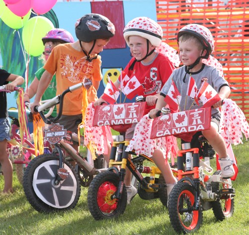 Children prepare for the annual bike parade at the 2012 Boogie Fest.