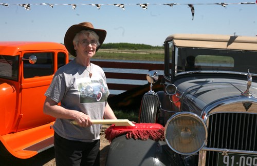 Joanna Nankivell mops off her 1929 Hudson Landau after driving it to Carlyle from Kisbey.