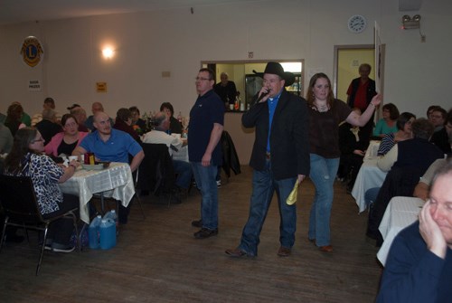 Auctioneer Ward Cutler came back to his hometown for his 17th year of facilitating the live auction.