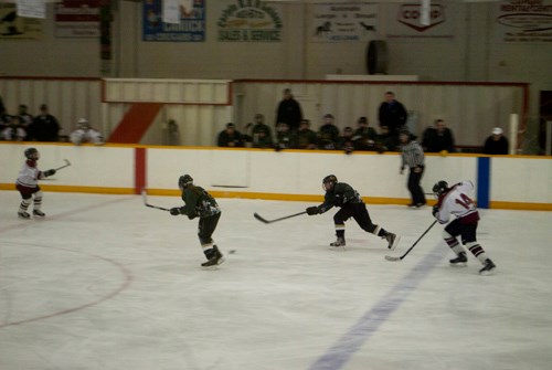 The Cougars take it out of their end during a provincial match against the Quad Town Rebels.