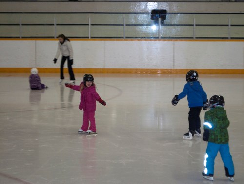 Youth enjoy zooming around the ice before practice begins.