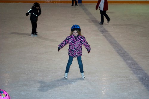 A youth goes zooming towards some friends.