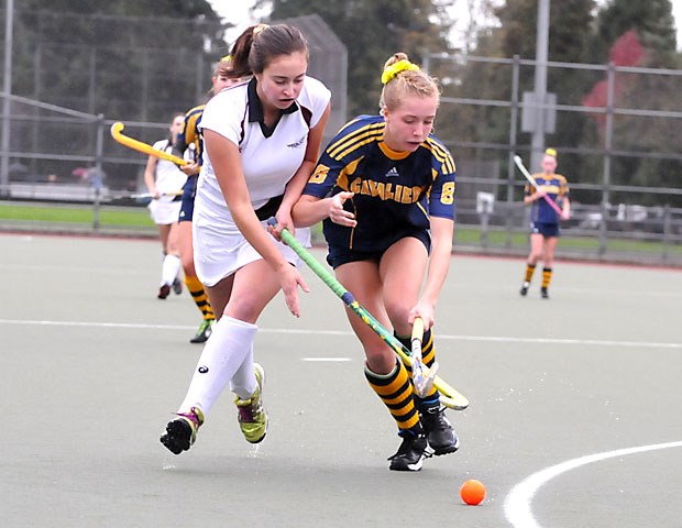 Collingwood's Hailey Szybunka (right) battles Rockridge's Monica Gregory during the North Shore AA field hockey final Thursday at Rutledge Field. Szybunka helped lead the Cavaliers to a 4-1 win.