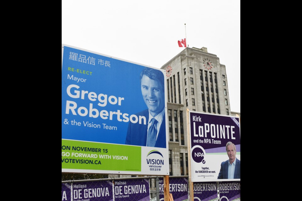 Dozens of campaign signs have sprung up in a vacant lot at the southeast corner of 12th and Cambie directly across from city hall. photo Dan Toulgoet
