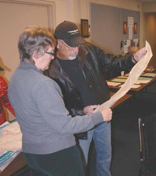 Heritage Day was celebrated at the Yorkton branch of the Western Development Museum Sunday. The theme was the generation of electricity in Canada. (See related stories Page A3). In addition the Yorkton Genealogical Society had displays. Here a map is studied to help trace a family.