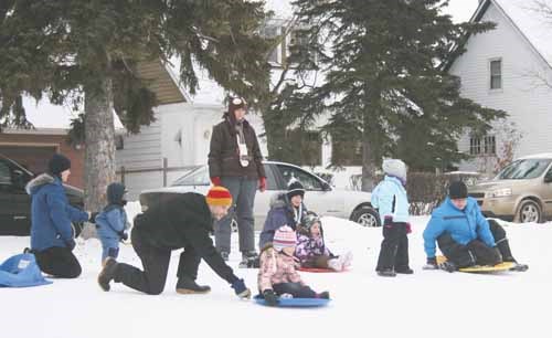 Sunday might have been a tad chilly thanks to a Saskatchewan wind, but that did not keep several Yorkton families from getting out and enjoying the winter activity of sledding. Here several sledders ready to head down Rodney Ridge.