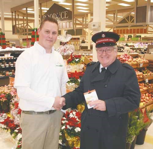 Sobeys in the Parkland Mall in Yorkton presented the Salvation Army with $4,000 toward Christmas hampers and food bank. The money was raised through an in-store customer promotion. Here Sobeys manager Bryan Boychuk makes the presentation to Major Ron Mailman.