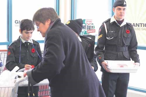 Cadets, from left, Cordell Struble, Kyle Taphorn and Christian Flaman sell poppies at Yorkton Coop Saturday as the annual Remembrance Day poppy campaign gathers momentum.