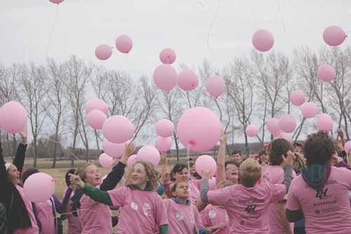 Determined Yorkdale Central School students stood up to bullying and bad weather on Friday during National Victims of Crime Awareness Week. Dressed in pink shirts, members of the Grades 4, 5, 6, and 8 classes conducted a march outside the school and released pink balloons into the gusting wind to signify their resolve to take a stand against bullying. Afterwards, they listened to an anti-bullying talk from Saskatchewan Roughriders defensive tackle Keith Shologan.