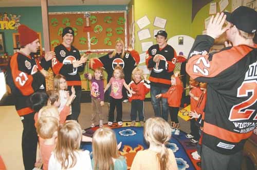 Members of the Yorkton Terriers Junior Hockey Club spent time last week visiting youngsters at the Yorkton Nursery School Co-operative. Here John Odgers, Tyler Giebel, Josh Ellis, and Daylan Gatzke participate in a sing-along with the preschoolers.
