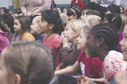 A multi-ethnic group of elementary school students reacts to Métis author and Order of Canada recipient David Bouchard&#8217;s presentation in MC Knoll/St. Michael&#8217;s gymnasium October 23.