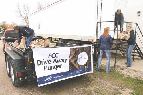 The local office of Farm Credit Canada has been gathering food through its annual FCC Drive Away Hunger initiative. Through efforts such as a food drive at a recent Junior Yorkton Terriers game, and cooperative efforts with local schools, farm machinery and agricultural supply companies, tons of food was collected. Recently the food gathered was then donated to two local food projects in the city. Pictured above, 4,651 pounds of food is delivered to Soup Haven. Another 1,778 pounds of food was presented to the Salvation Army. The total collected was 6,429 pounds.