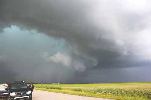On July 15th, we were on a grid road somewhere between Rouleau and Weyburn, heading towards this intense storm cell that dropped heavy rain and hail and met up with another Storm Spotter, Tia Griep - the photo shows how large the storm was!

STORM FACT OF THE WEEK: Waterspouts are tornadoes that form over a body of water. 
Check out current and past storm photo galleries, see my latest youtube videos or tune in on the action with a live stream when I am out out chasing - all at:www.yorktonstormhunter.com