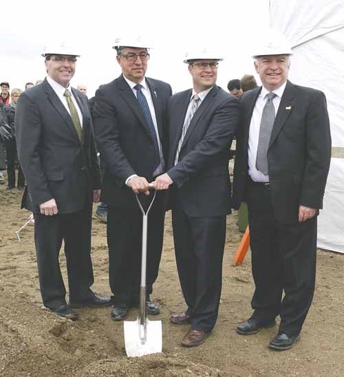 Yorkton MLA Greg Ottenbreit, Deputy Premier Ken Krawetz, Advanced Education Minister Rob Norris, and Yorkton Mayor Bob Maloney pose with the ceremonial shovel used for Tuesday&#8217;s sod-turning ceremony. The shovel was crafted in 1998 in honour of Parkland College&#8217;s 25th Anniversary by a pre-employment welding class held in Fort Qu&#8217;Appelle.