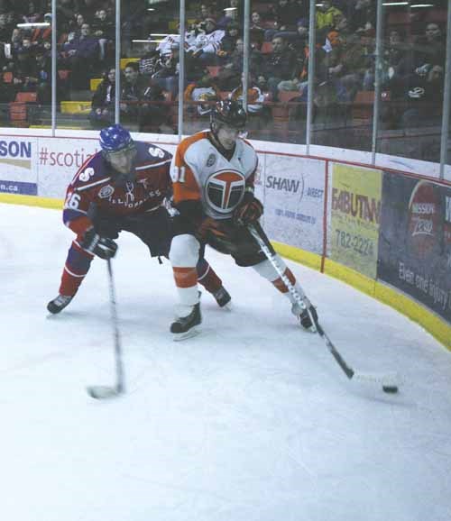 The Yorkton Terriers won a pair over rival Melville on the weekend to raise their record to the best in the Saskatchewan Junior Hockey League. Here Terrier Tayler Thompson controls the  puck in the corner at the Farrell Agencies Arena Saturday, (See related story under Local Sports).