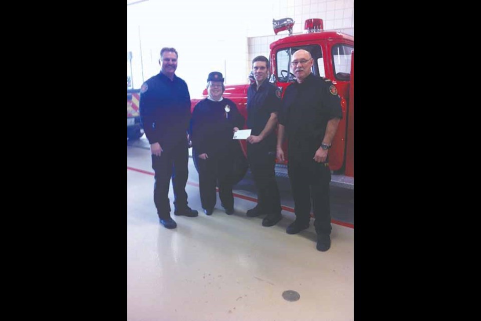 Yorkton Professional Fire Fighters $300 donation to the Salvation Army. Below left to right: Neal Matechuk, Major Linda Mailman, Ted Putland, Brian Belitsky.