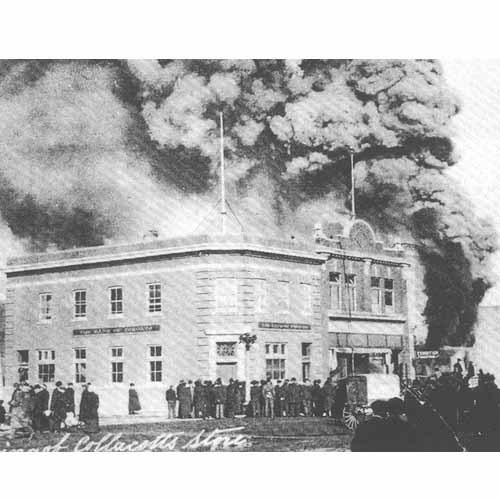 Fire has always been the most feared of disasters by pioneers because 
firefighting equipment was all but non-exsistent. This fire burned down Collacotts Store on Broadway Street on March 10, 1915. Yorkton&#8217;s early 
councils put some emphasis on fire fighting equipment, however, and the equipment of the day included a horse-drawn chemical engine holding two 40-gallon tanks, with a one cylinder gasoline engine, two or three ladders and about 500 feet of hose. A year after this fire, the city purchased its first fire truck, a 1916 Ford chemical truck with two 25-gallon tanks. In 1918 a 
60-horsepower Studebaker hose truck was purchased for the fire brigade, a piece of equipment which was to serve the fire department for the next 29 years. Until 1947 the fire chief was the only full-time member of the 
department, with the first brigade made up of volunteers.