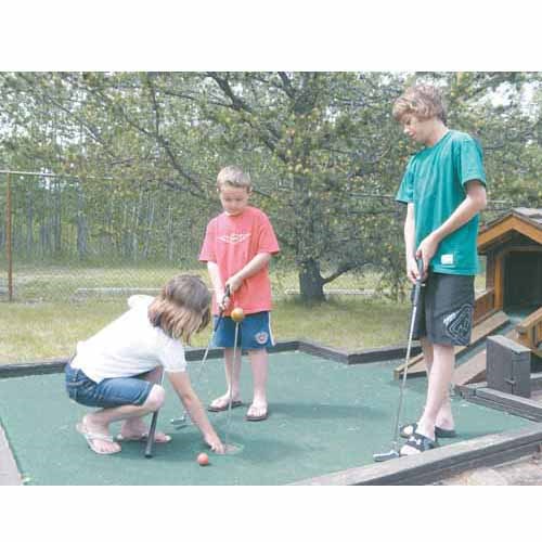 May long weekend at Good Spirit Lake was a cool one, but the Davies family enjoyed a round of putt putt golf on a sunny Victoria Day. Left to right: Avia; Dawson; Dryden.
