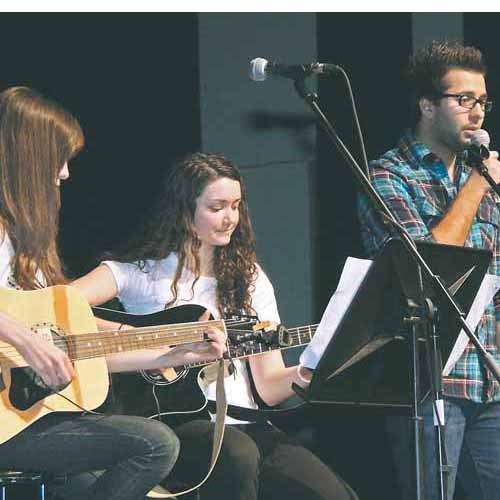 The YRHS Guitar Club held their 3rd Annual Showcase, on Thursday,   May 13, 2010. Twenty-five students and staff 
performed original and cover tunes.   The evening included a guest performance by Guitar Club alumnus, Sean Craib-Petkau. Pictured above from left to right is Kelsey Fraske-Bornyk and  Kristin Boychuk and Ody Tsagouris.