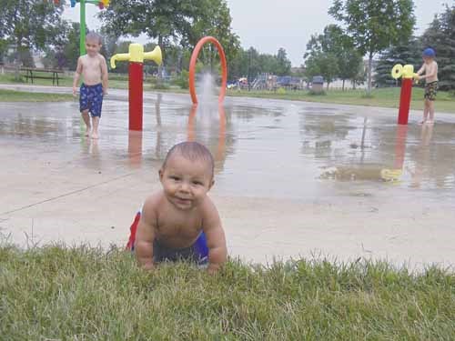 The Lafontaine family took baby Carson Bellegarde to the Weinmaster spray park to gain relief from the hot temperatures on July 14. Hotter temperatures are expected to return this week, after a few days of drizzle.