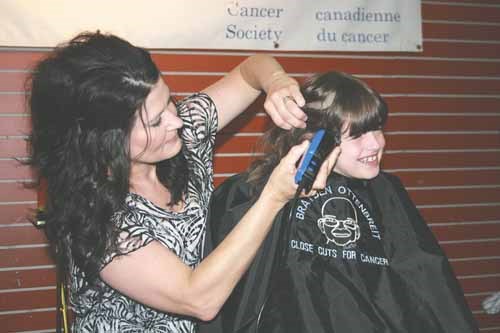 The 15th Annual Brayden Ottenbreit Close Cuts for Cancer head-shaving event was held Saturday at the Parkland Mall in Yorkton. This year the event raised more than $40,000 for research and more $11,000 for local initiatives. Here Daylia Lukey of Canora gets her cut from Mona Maddin.
