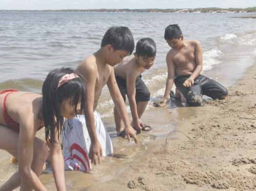 Friends Andrea, Neo, Andrei and Gabby, ages 6-11, have fun at the beach at Good Sprit Lake Provincial Park on Saturday. The park is now open for the season, with a range of activities and special events scheduled for the warm weeks ahead.