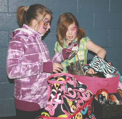 Area Girl Guides held a trade show Sunday at Yorkdale Central School. The trade show was a fundraiser for the Parkland Prairie Extra Ops Girl Guide group. The group is going on an international trip next summer where approximately 30 girls will travel abroad for nine days. To make the venture affordable for the girls (and Leaders) they are doing a lot of fundraising. The show included 29 booths, as well as, Girl Guides offering face painting, Girl Guide cookies, and a cookbook table. The group also sold raffle tickets on a Quad they will be drawing for near the end of July at the car show.