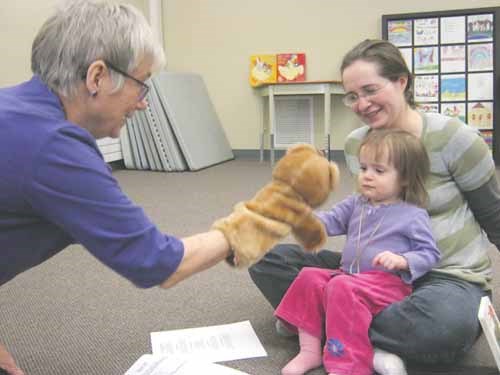 Melody Wood entertains Shelby and her mom at the Yorkton Public Library April 18. The library offers a variety of programs during the week for infants, toddlers and older children.