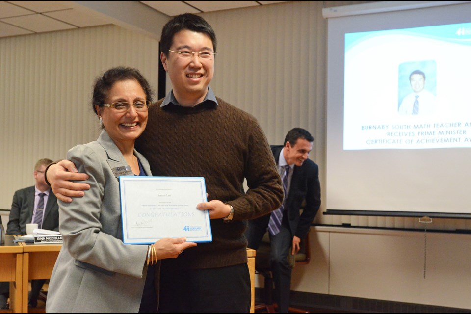 Burnaby South Secondary math teacher Amos Lee poses with school board chair Baljinder Narang at a public board meeting last week.