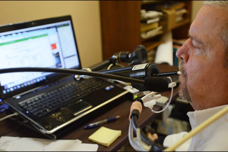 Accountant Don Danbrook works on commercial real estate files at New Westminster’s Penny and Keenleyside Appraisals, a job he got through the Neil Squire Society’s Working Together Program.