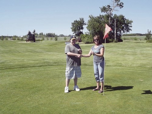 Charles Beaudoin was out for a round of golf at the par three Rustic Nine Golf Course with his father Dan June 21. Beaudoin aced the108-yard seventh hole. Elaine Liebaert, co-owner of the course, presented Beaudoin with a hole-in-one key chain and a pass for another round of golf for his shot. Rustic Nine Golf Course is located just two minutes north of Territorial Drive on Millar Road.