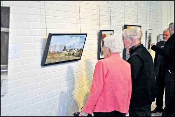 One of the popular paintings viewed during the reception of the 25th Annual Art Auction and Dinner presented by the North Battleford Bonaventure Lions was North Battleford at 100 by Herman Friesen. The event was hosted at the Chapel Gallery Friday night with proceeds of the auction going towards Battlefords Trade and Education Centre Inc. Along with the artwork available, there was also a silent auction of donated items.
