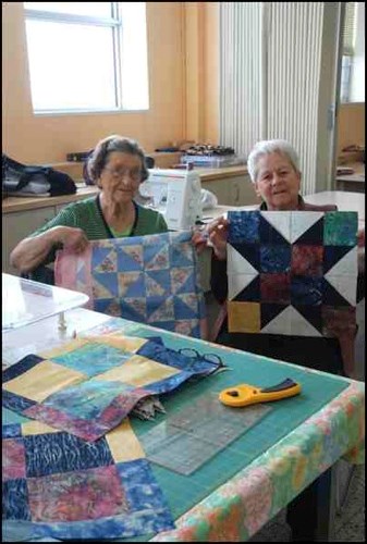 The Rivers&#8217; Edge Quilters indulged their passion for beautiful fabrics and fascinating patterns Thursday, Friday and Saturday in a quilting marathon. Above, Ann Fylyma and Rita Parker show off their work. Some quilters, like Parker, were working on a &#8220;mystery quilt,&#8221; putting pieces together from a series of seven clues. Only with the last clue would they know what the final design would be. It was fun, they said, because they never knew what to expect next.