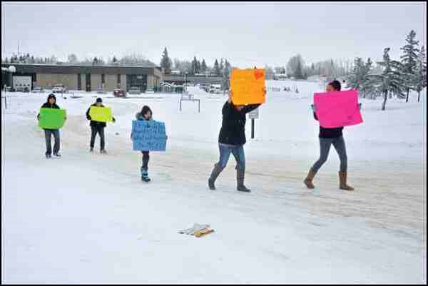 This was the scene around noon hour in front of North Battleford Comprehensive High School Friday. A number of youth staged an Idle No More &#8220;flash mob&#8221; in front of the high school. It was a peaceful demonstration, as a small group of marchers waved placards in support of Idle No More. They received encouragement from some who drove by on nearby Diefenbaker Drive who honked horns in support of their cause.