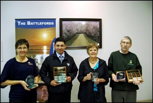 At an annual luncheon May 18, Battlefords Tourism presented four awards. From left to right: Gold Eagle Lodge, represented by Laura Allan, the Gold Eagle Casino, represented by Human Resources Manager Kevin Sapp, tourism volunteer Donna Fuhr and Roger Giesbrecht, photographer and volunteer for Battlefords Tourism. The Gold Eagle Lodge received an award for its work in human resources &#8211; work that was recently honoured with a Tourism Saskatchewan Award of Excellence. The Gold Eagle Casino was a finalist in the same category. Fuhr received her award for her many hours of dedicated service to the community, and Giesbrecht&#8217;s is one in a long line of awards he has recently received. North Battleford galleries recently awarded him their first-ever lifetime volunteer award, and he was given the 2011 North Battleford Western Development Museum&#8217;s Volunteer of the Year award. The luncheon bookended Tourism Week in the Battlefords.