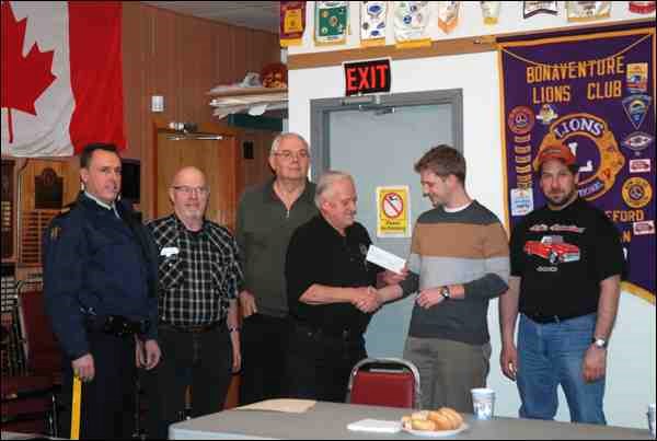The North Battleford Lions Club has made a significant donation to Battlefords KidSport, which provides grants to remove financial barriers for children looking to register in sports, handing over a cheque for $8,800 Monday. Some of the funds came from donations made by people who use the service offered during the annual Operation Red Nose initiative. This was the fifth year for Operation Red Nose in the Battlefords, which was the first Saskatchewan community to launch the initiative. This year, said Lion Bill Bowman, North Battleford volunteers drove 249 vehicles home, and double that in numbers of people. There were 40 local volunteers, of which 11 were members of either the North Battleford Lions, the Bonaventure Lions or the Historic Battleford Lions Clubs. Nationally, this is the 30th year for Operation Red Nose, which is set up in over 100 communities in six provinces and volunteers have reached the one million mark, said Bowman. Across Saskatchewan, 16,000 rides home were provided over the holiday season. Volunteers must all have criminal record checks done, which the RCMP provides. Left to right at the cheque presentation were Sgt. Darcy Woolfitt, Lions Gord Mullett, Bill Bowman and Merv Stepko, David Schell of KidSport and Lion Marc Bonneau.