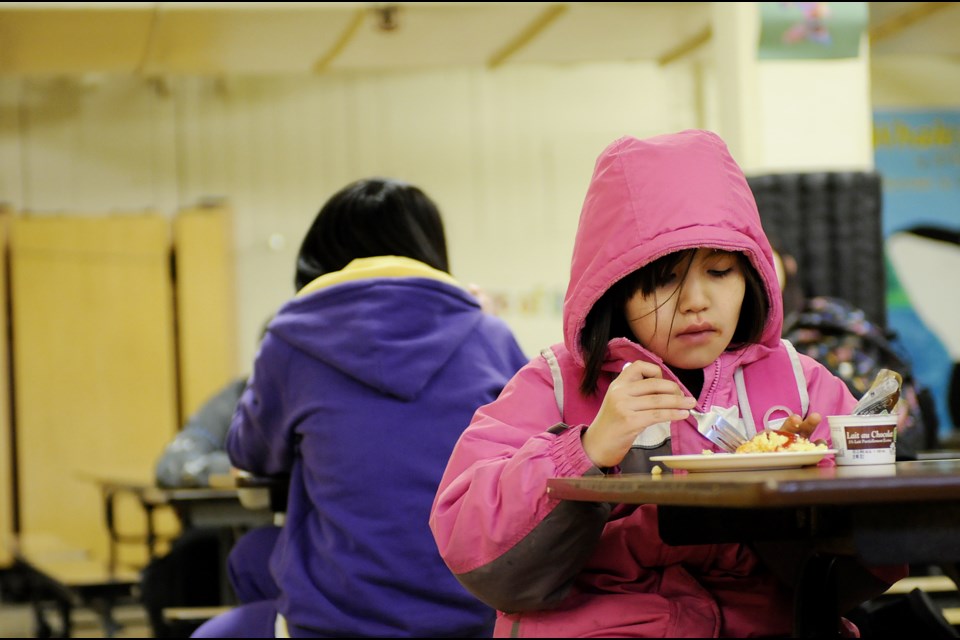 Carissa Ned eats breakfast at Sir William MacDonald Elementary school. A Re-visioning Inner City and CommunityLINK Resources in Vancouver Schools consultation and report the board completed last year sees three tiers of support for Vancouver schools. Photo Dan Toulgoet