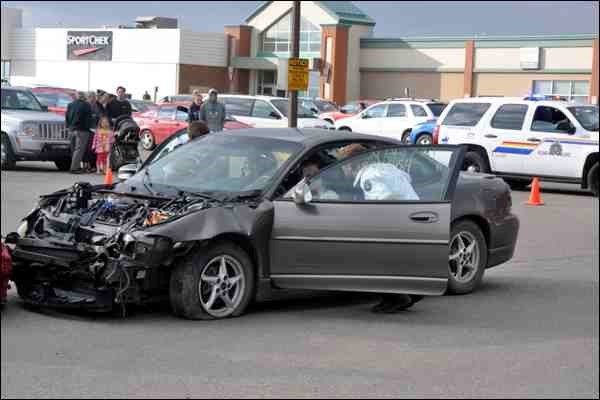 One person was killed, two were injured and a driver was taken into custody following a head-on collision at the Frontier Mall parking lot Thursday evening. The incident provoked a major response from WPD Ambulance as well as the fire Department and the RCMP. Fortunately, though, it was all staged: it was actually the annual &#8220;Mock Accident&#8221; put on by WPD Ambulance as part of EMS week. The week included presentations to schools as well as a beef on a bun luncheon Friday at noon. The theme of the week, dedicated to community understanding and awareness of the role of EMS, was Our Family Caring for Yours. The accident victims were portrayed by high school students involved in Students Against Driving Drunk, helping send a message to young people about the dangers of drinking and driving.