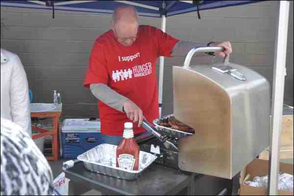 May 7 marked the kickoff to Hunger Awareness Week, and a hot dog and hamburger sale was held over the noon hour outside CJNB Radio with proceeds going to the Battlefords Food and Resource Centre. Food Bank Executive Director Bill Hall (top left) was one of those on hand to help hand out some food for those who dropped by during the event.