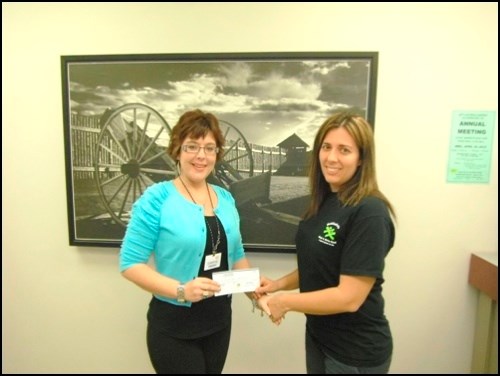 Battlefords and District Co-op hosted Child Save identification service last week, with a portion of the proceeds going to the Battlefords Boys and Girls Club. Leanne Butler, marketing and communications manager, presents a $200 donation to Sheri Woolridge, executive director of the Boys and Girls Club.
