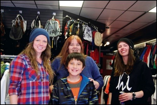 Martinez, centre, won the award for youth fundraising for Big Brothers Big Sisters&#8217; Bowl for Kids&#8217; Sake. His award was a skateboard from Freedom. From left to right, Alanna Tucker of Freedom, Valerie Montgomery-Bull from Big Brothers Big Sisters and Jen Bernier from Freedom.