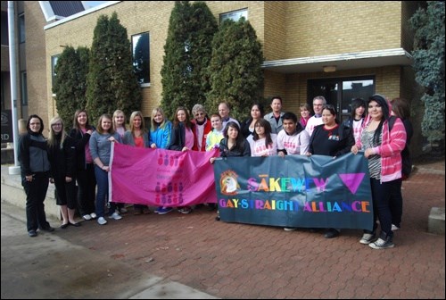 Students from McKitrick, John Paul II, and Sakewew gathered to raise a pink flag in commemoration of the Pink Revolution Anti-Bullying Week.